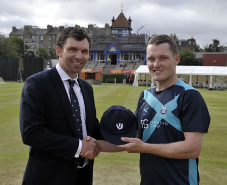 Hamish Gardiner receiving his Scotland cap